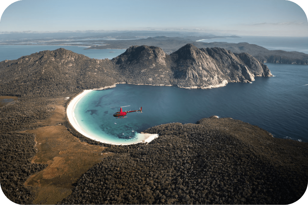 a body of water with a mountain in the background