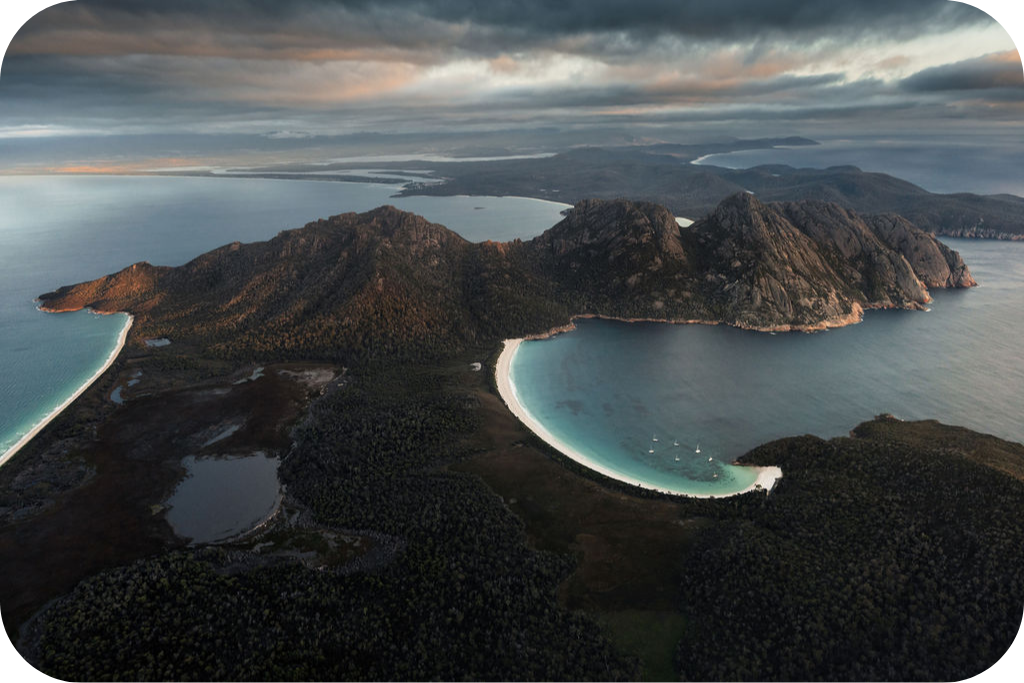 a body of water with a mountain in the background